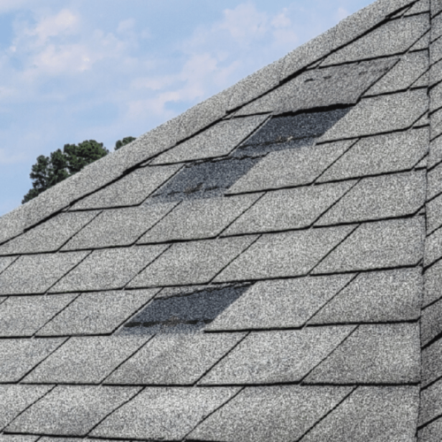 Roof-with-missing-shingles-from-wind-damage